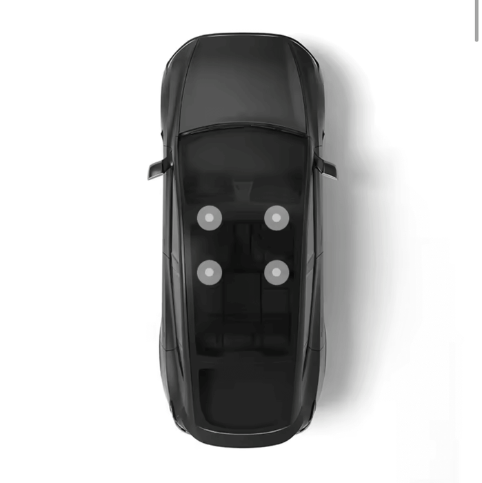 Overhead view of a black Tesla Model Y showing interior layout and seating arrangement.