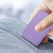 Stylish purple Magsafe Deluxe powerbank being held, showcasing slim design and digital display.