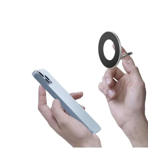 Person holding a smartphone and 360° Magsafe ring holder, demonstrating magnetic attachment and 360-degree rotation features.