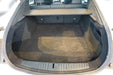 Tesla Model S trunk interior showcasing spacious black cargo area suitable for protective liner mats.