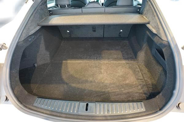 Tesla Model S trunk interior showcasing spacious black cargo area suitable for protective liner mats.